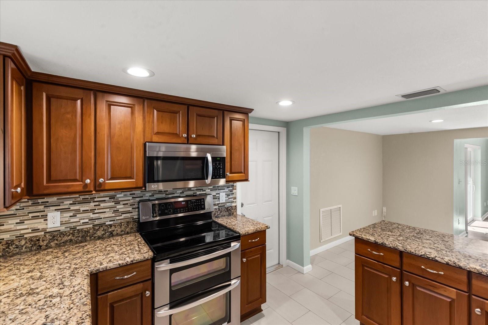 KITCHEN WITH CONVECTION OVEN/MICROWAVE, NEW FIRE RATED DOOR TO GARAGE