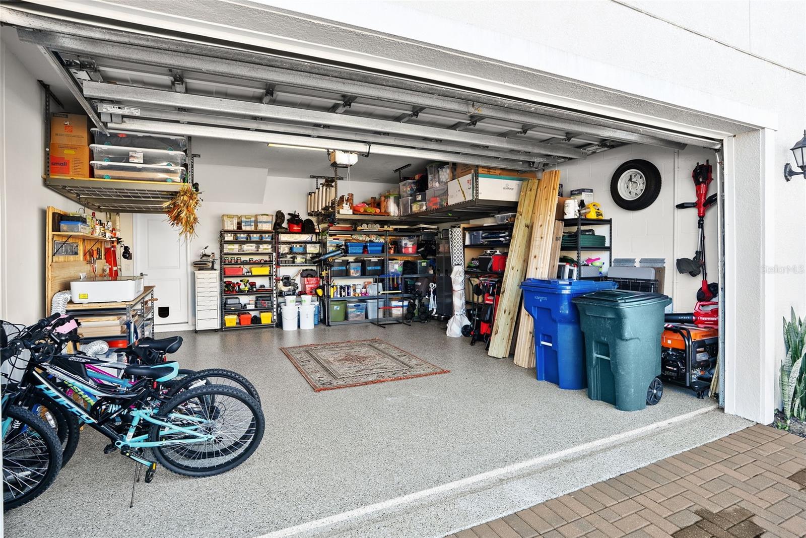Garage with overhead storage and epoxy floor
