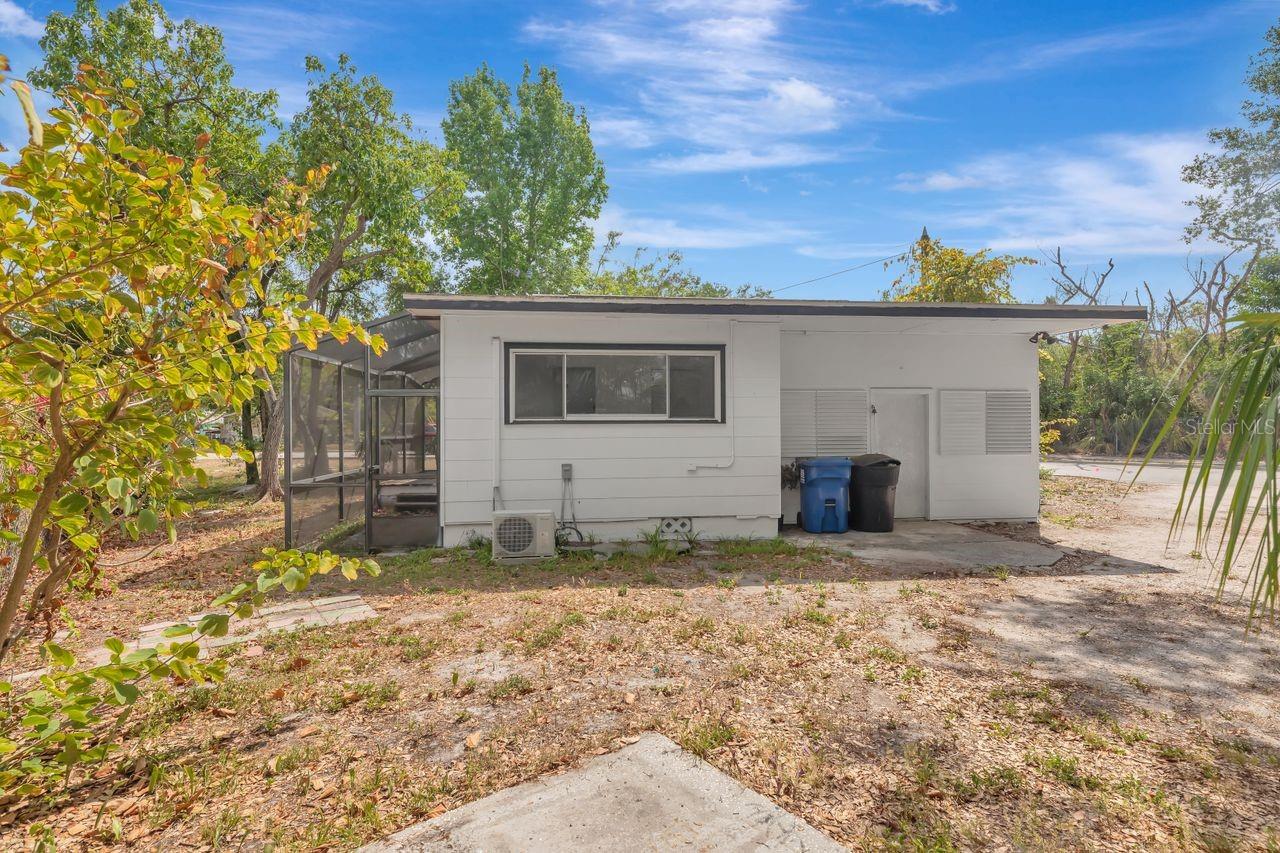 Large side yard and parking pad