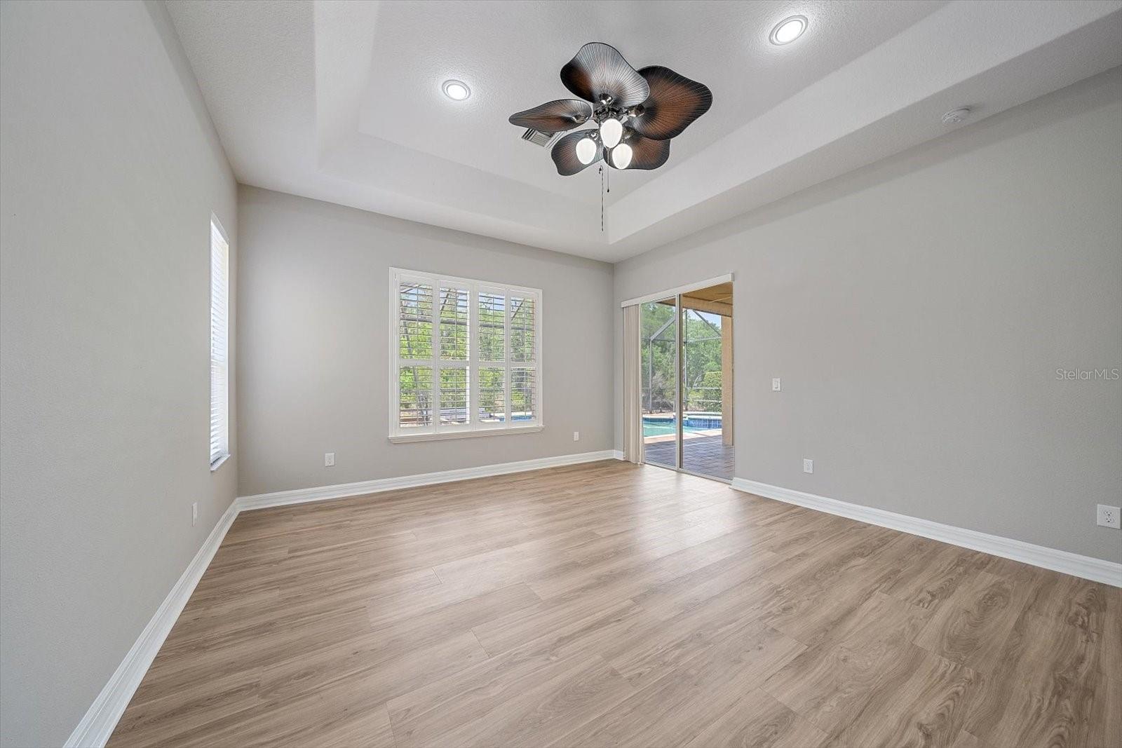 Primary Bedroom with pool view