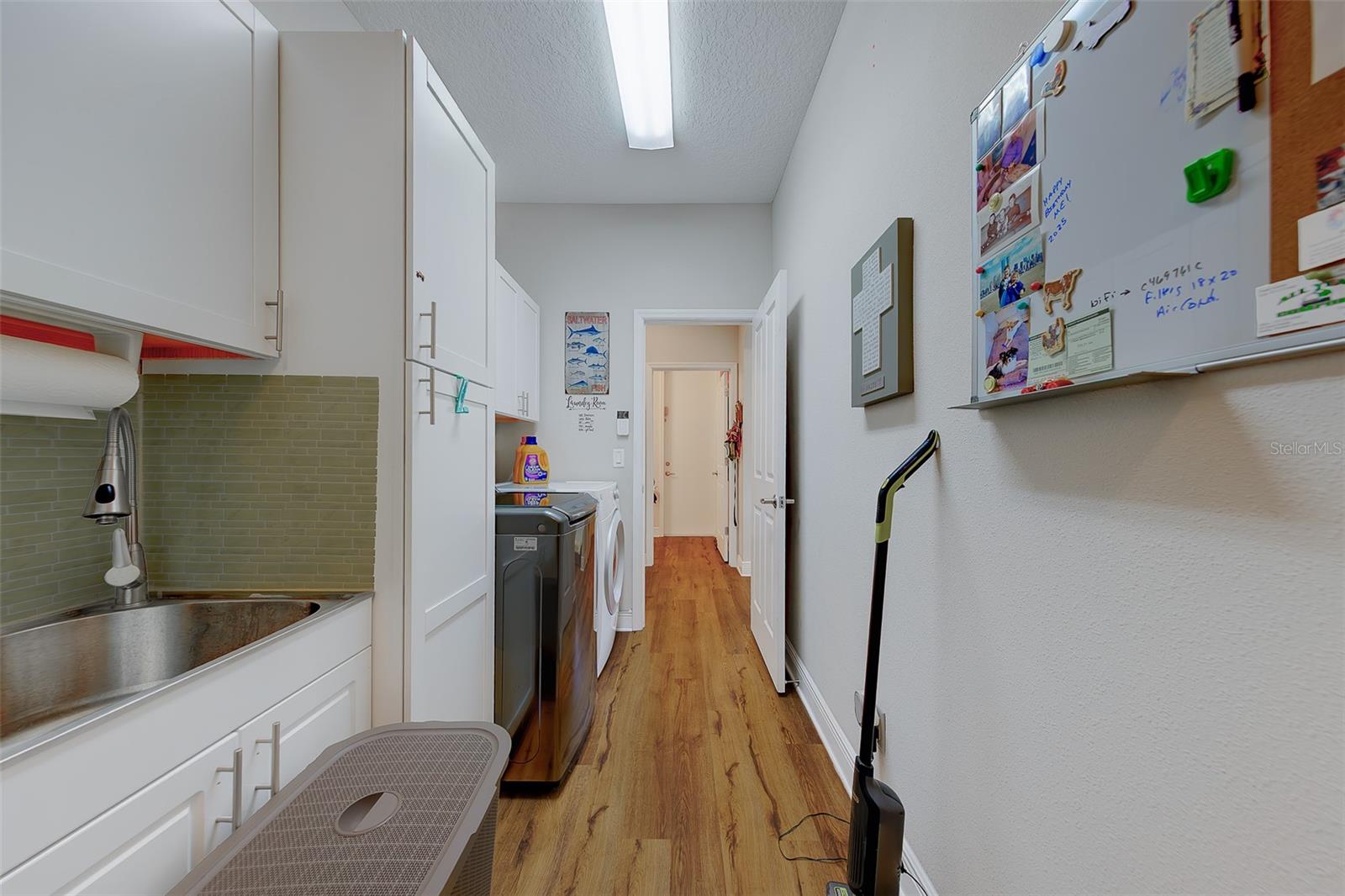 Laundry wash tub and additional cabinets