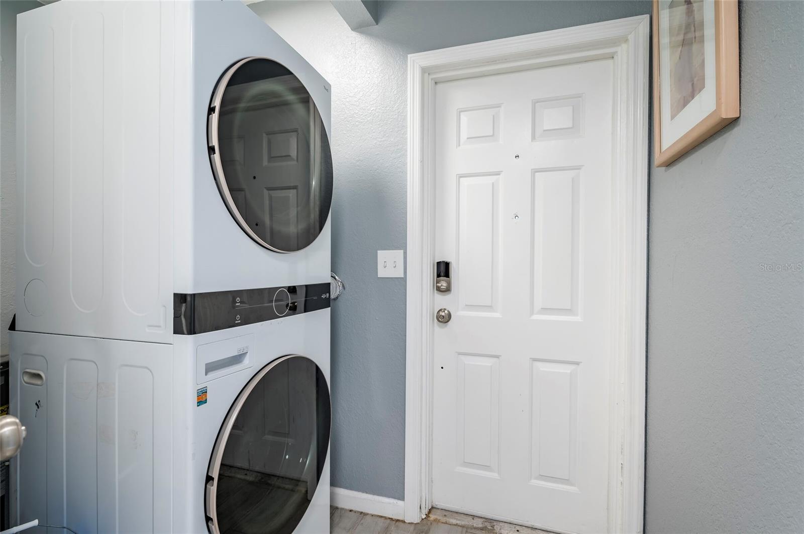 Laundry next in the hall to onsuite bathroom. Door to the  South Side Yard/Boat Storage.
