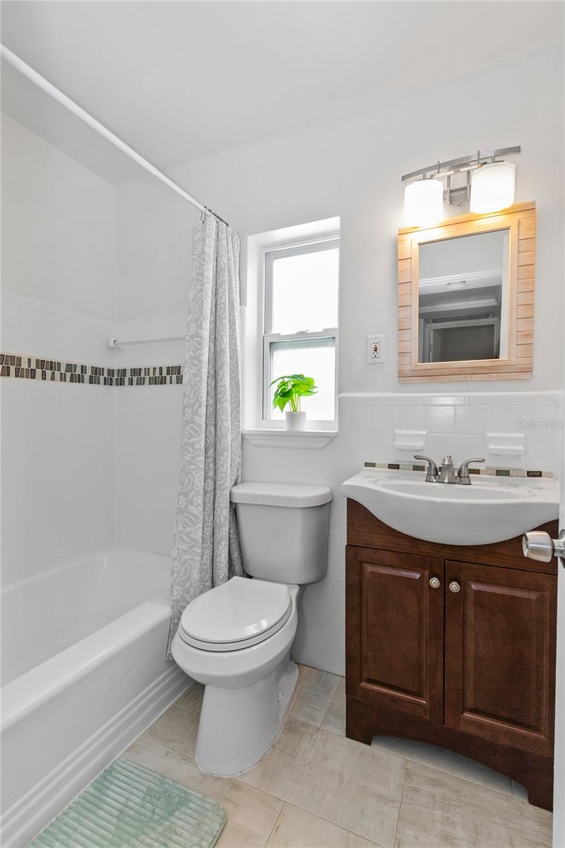 Main bathroom has updated shower/tub