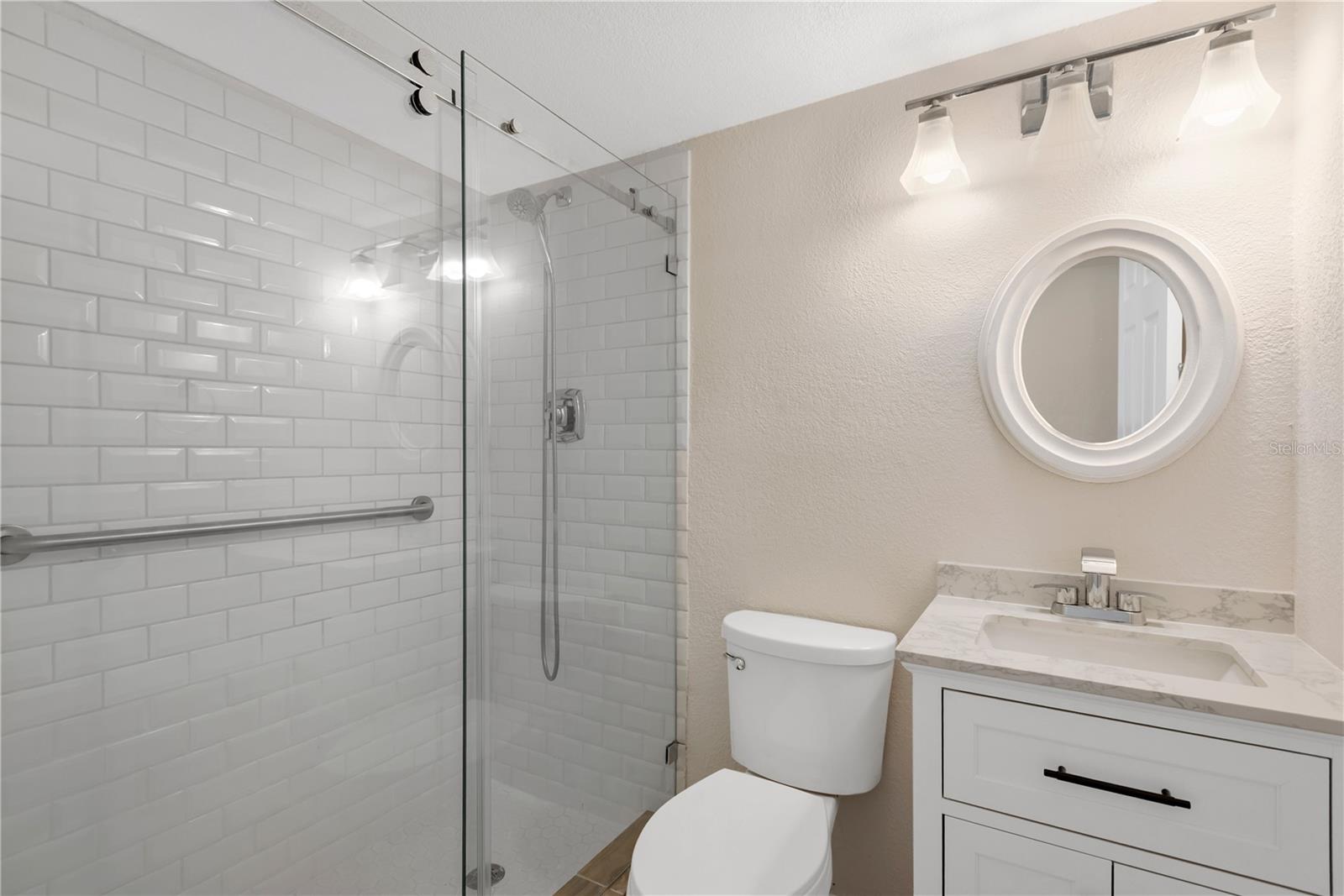 Gues bathroom featuring walk in shower