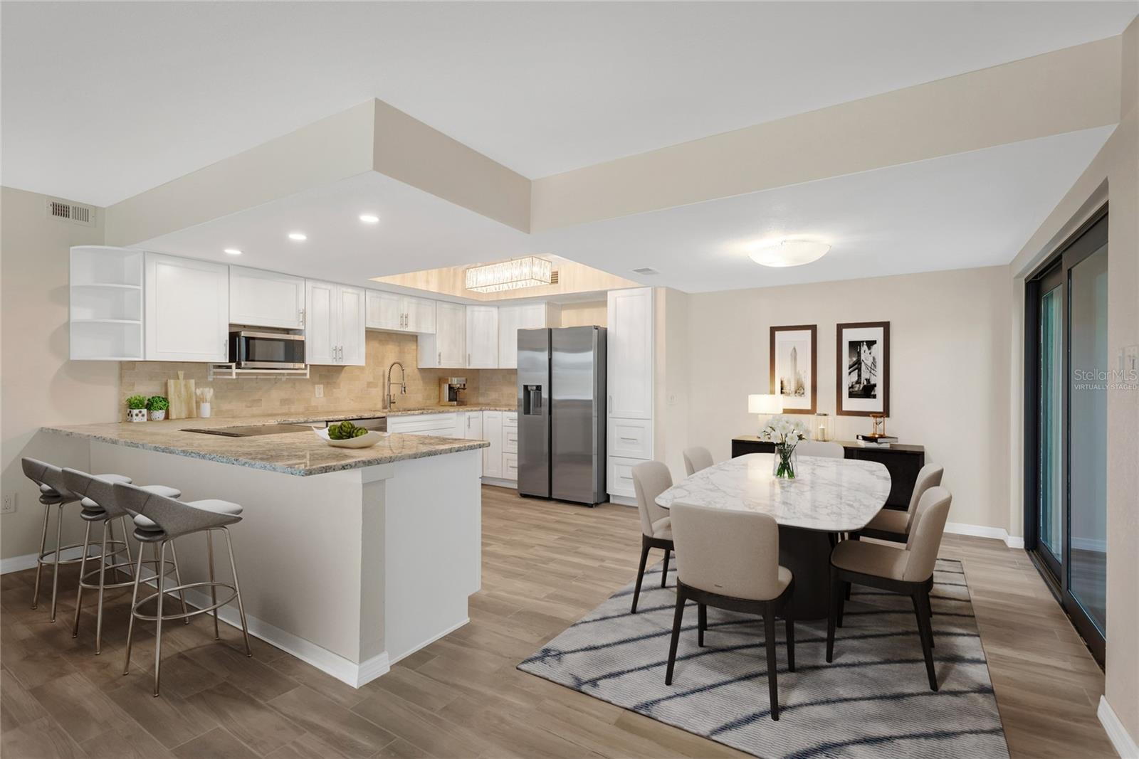 Eat in Dining room off of the kitchen that features granite countertops and stainless steel appliances