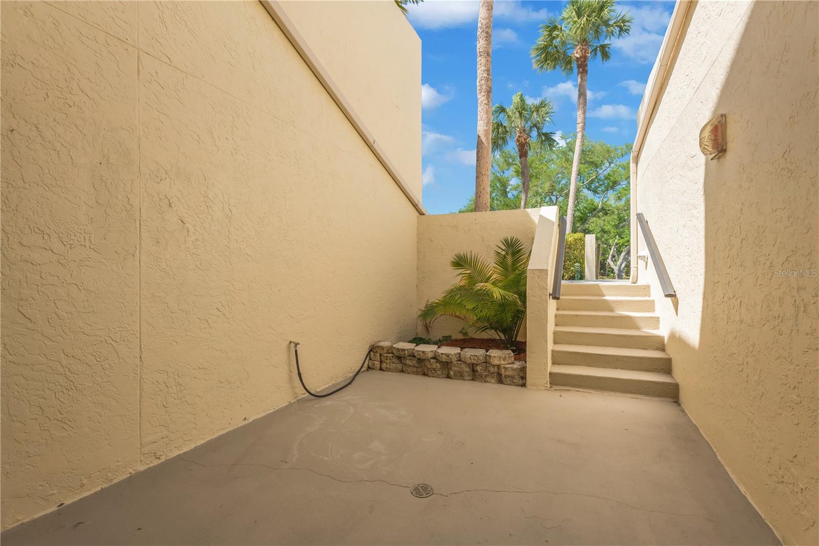Private rear patio located off of guest bedroom