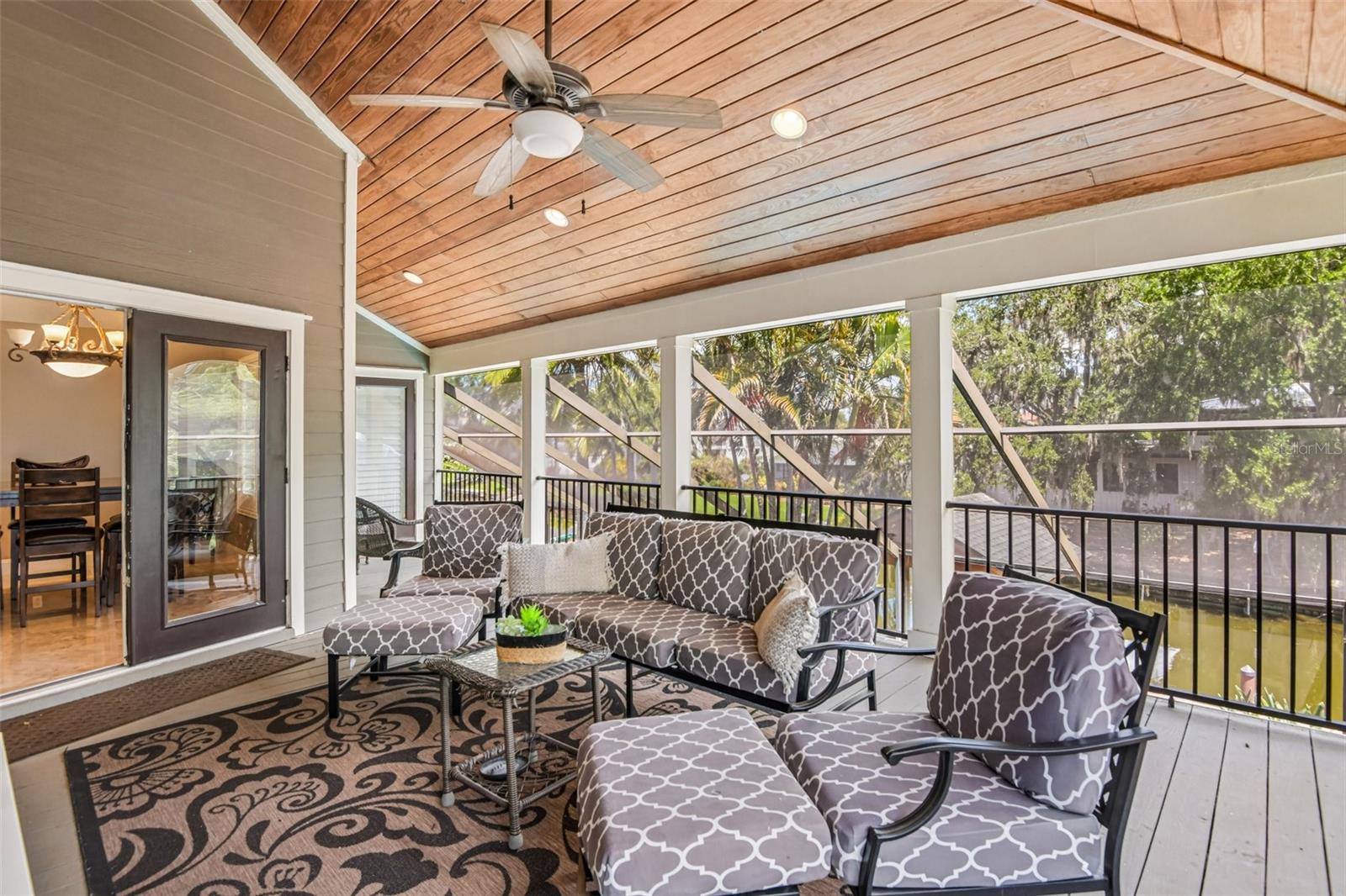 COVERED PATIO OVERLOOKING CANAL AND POOL