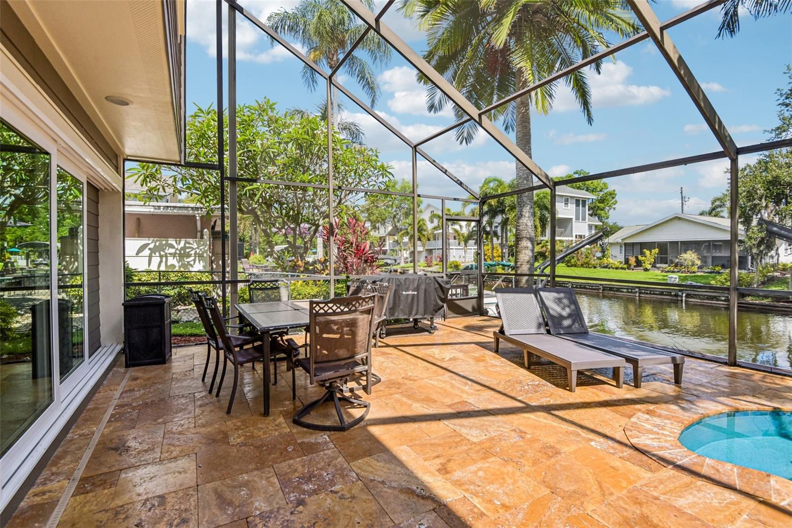 TRAVERTINE PATIO DECK- PEBBLETEC POOL SURFACE- POOL HEAT PUMP- SALT POOL
