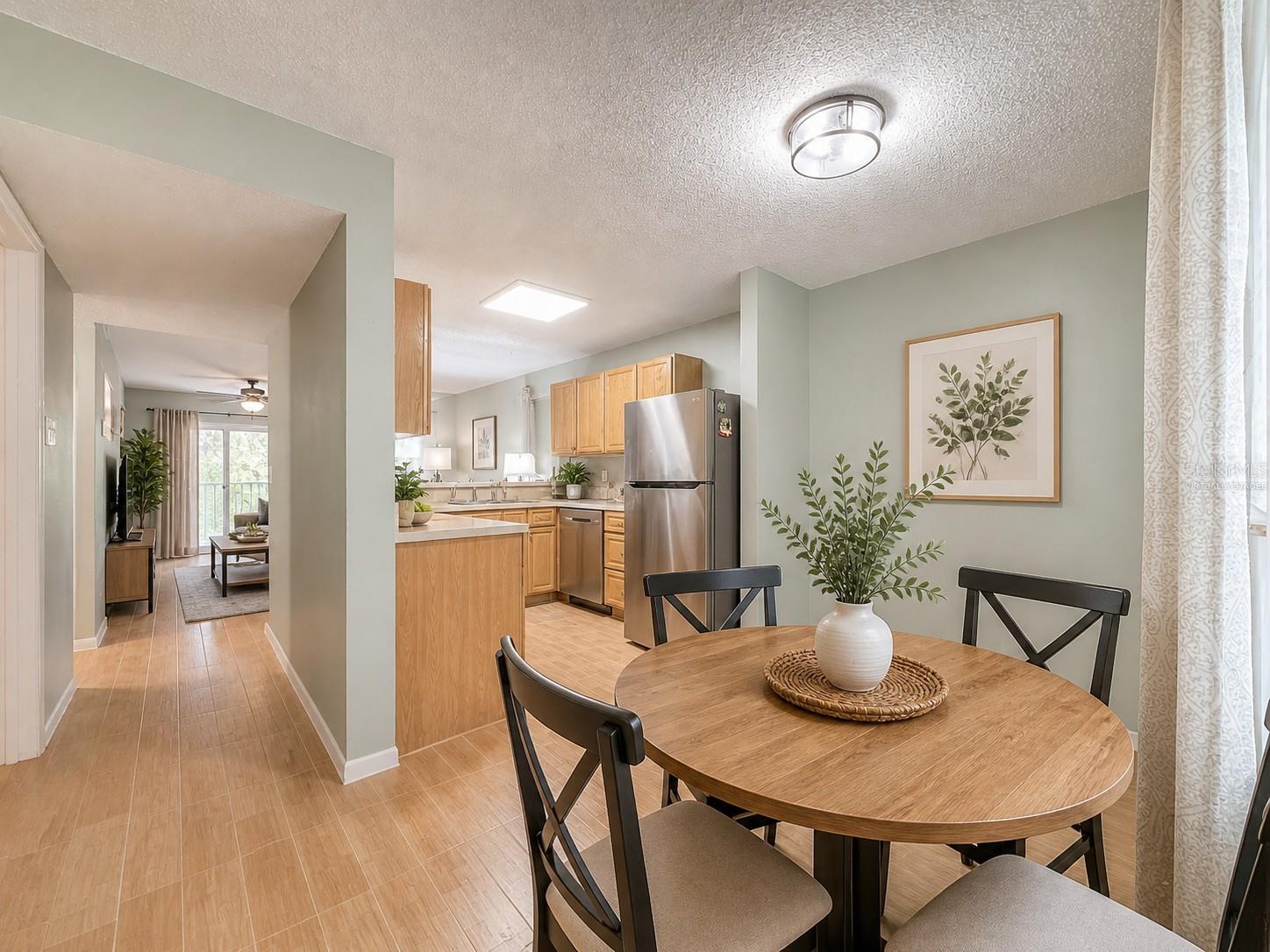 Virtually Staged - open floor plan - kitchen - casual eating space - living area