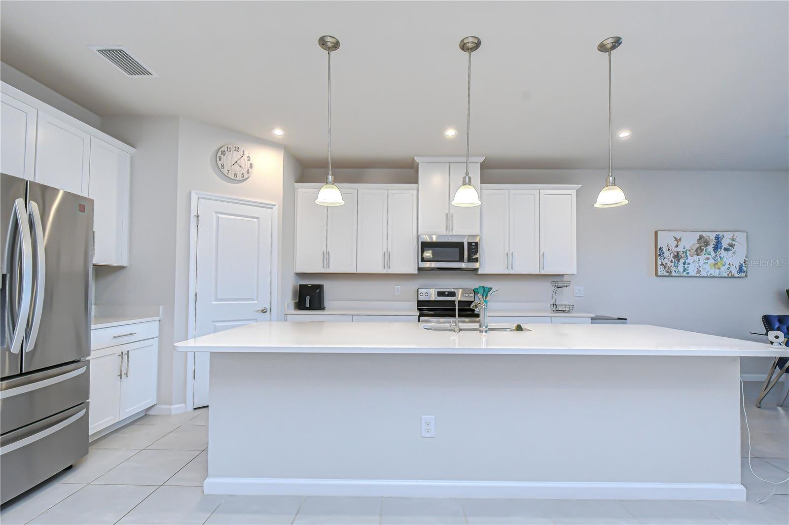 Well-appointed kitchen with modern appliances and a spacious island.
