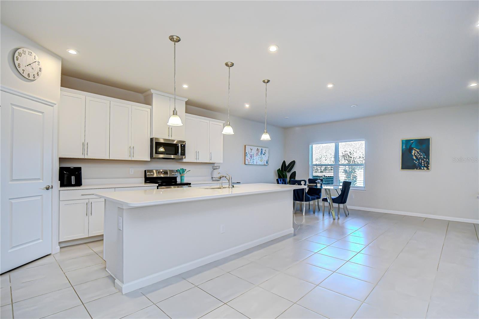 Full kitchen view showcasing abundant workspace and storage.