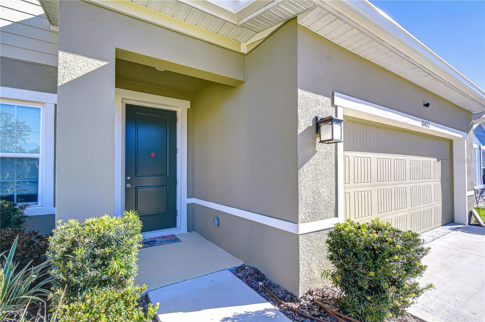 Alternate exterior view highlighting the welcoming entryway.