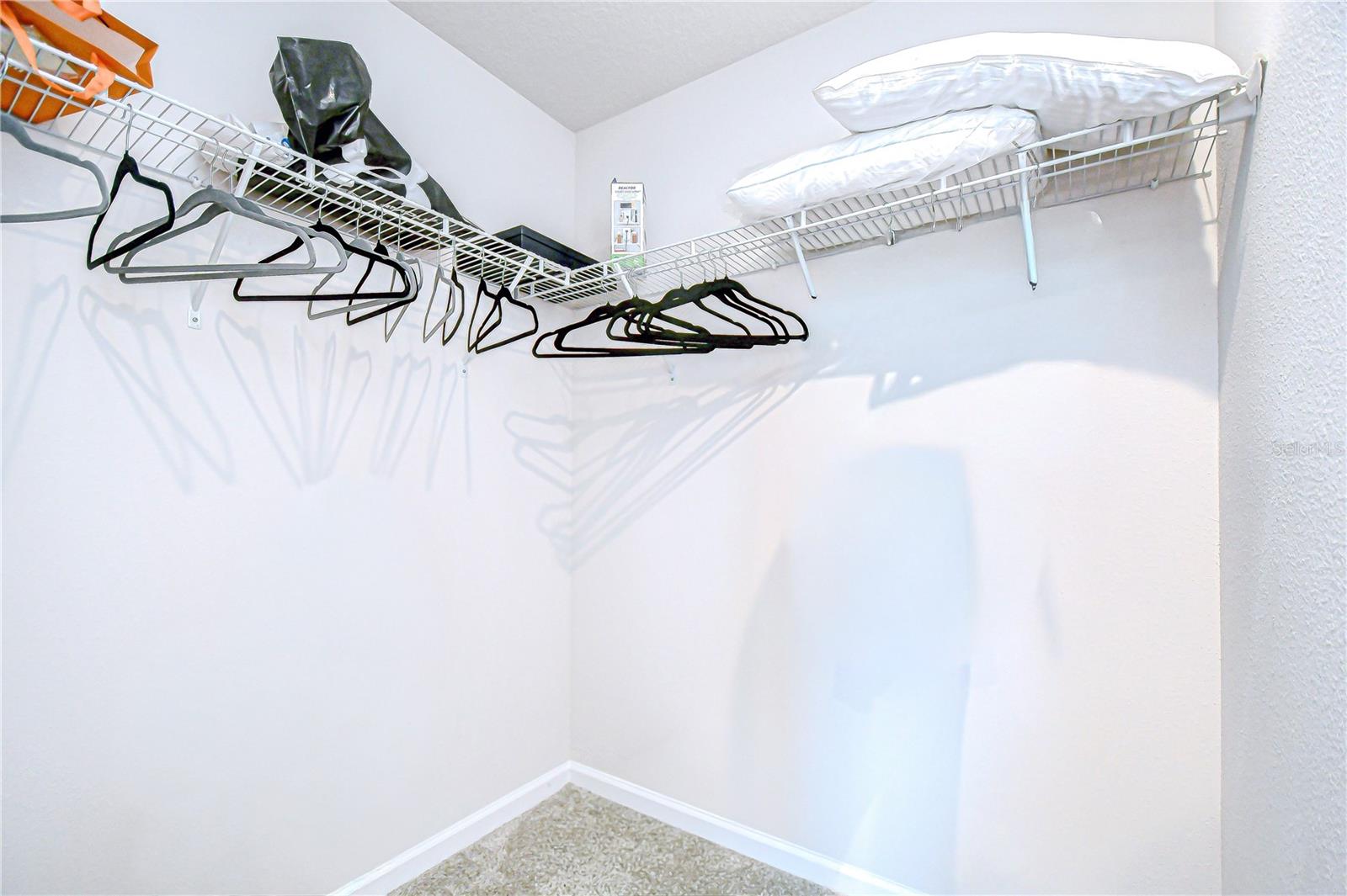 Large walk-in closet designed for optimal organization.
