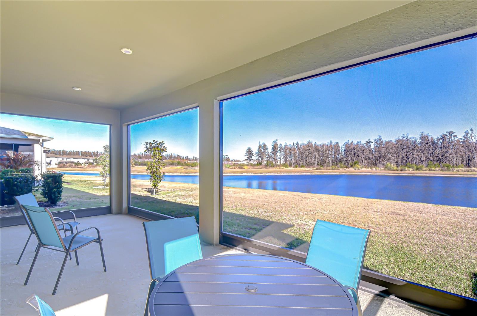 Enjoy peaceful waterfront scenery from the screened patio.