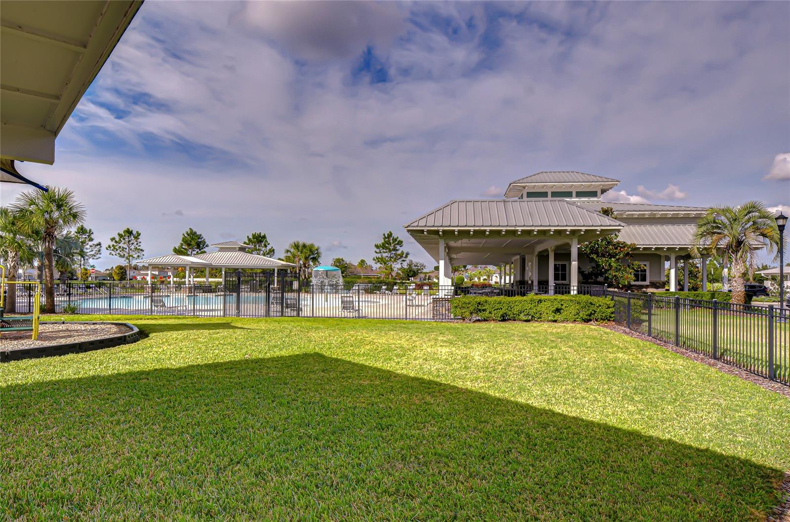Exterior clubhouse view highlighting community amenities.