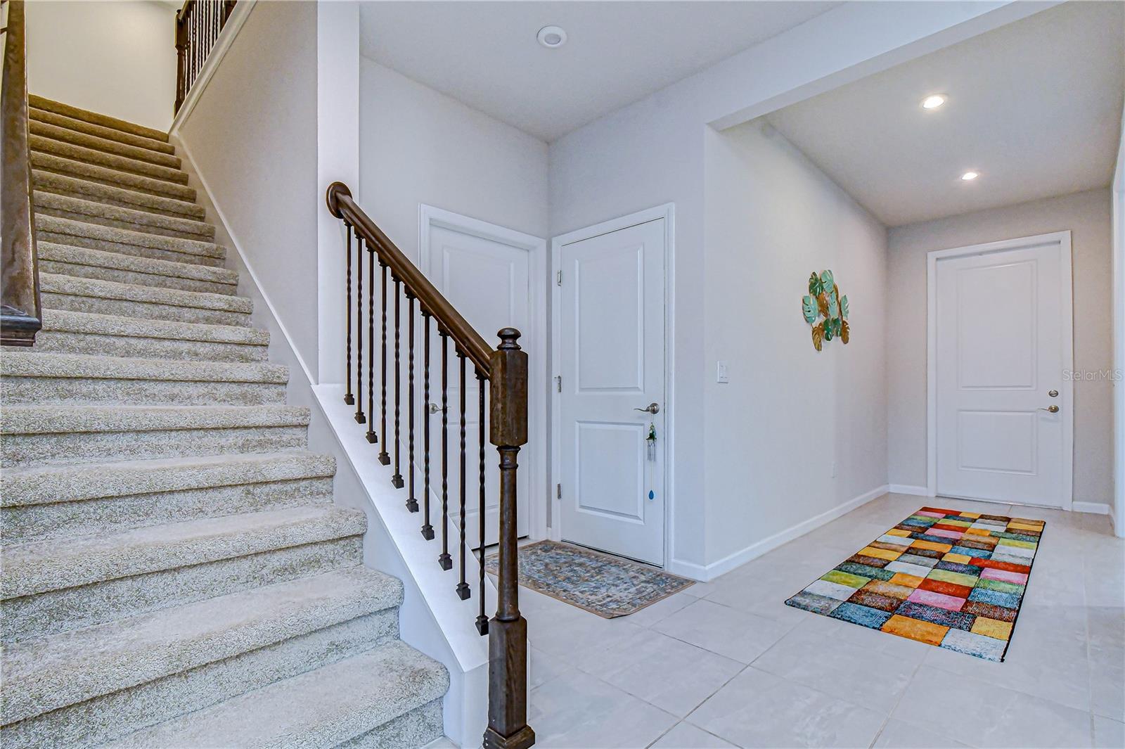Open foyer view featuring staircase leading to the upper level.