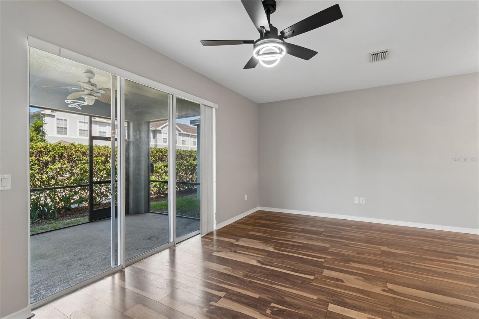 living area overlooking screened in porch