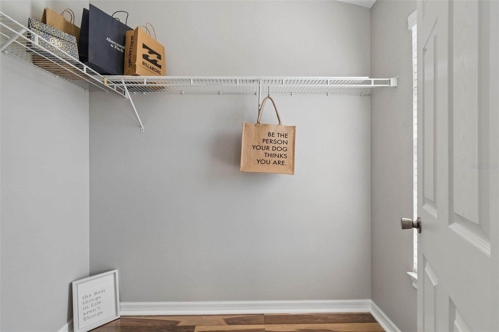 Primary bedroom walk-in closet