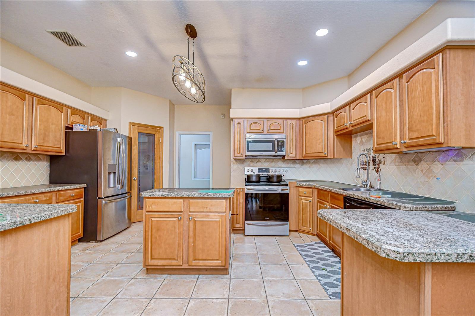 Kitchen with abundant cabinetry & counter space