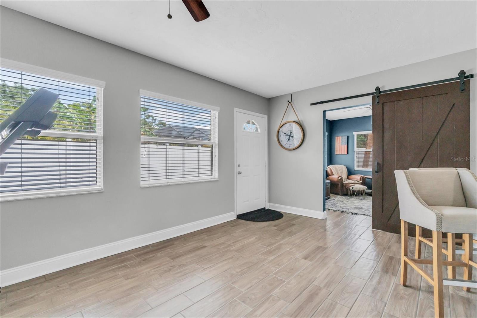 Versatle Bonus Room - Barn door to Office/Den - Exterior door to backyard