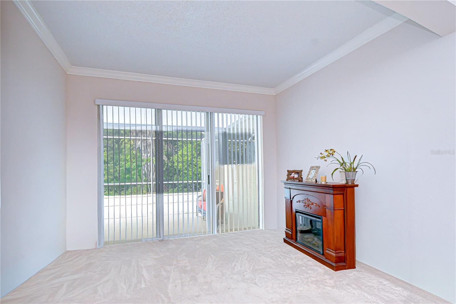 Extended Primary Bedroom with Decorative Fireplace