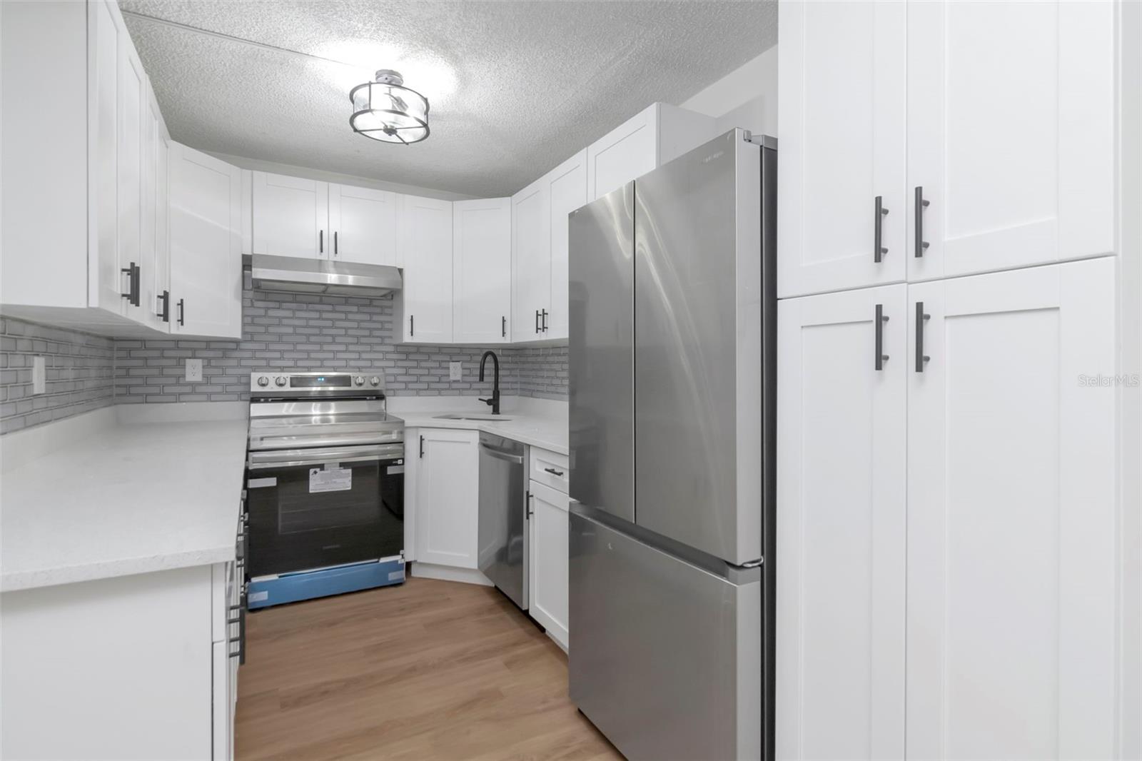 Stylish Kitchen with Granite Countertops & Subway Backsplash