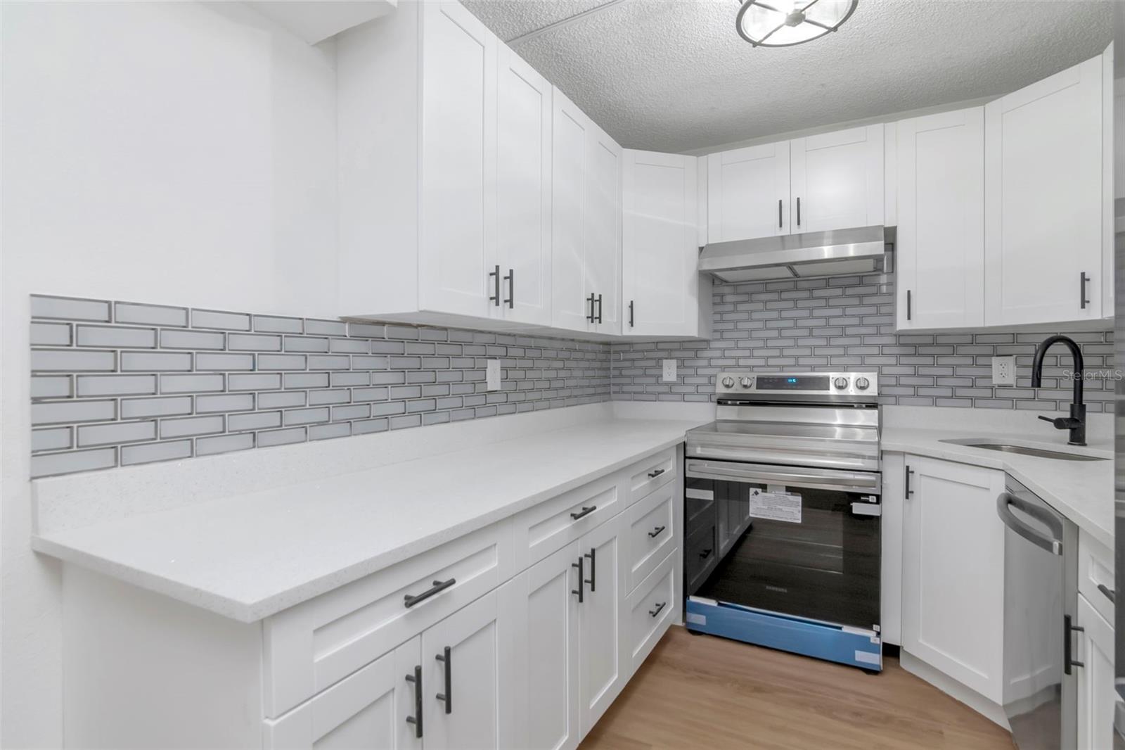 Renovated Kitchen with Beautiful Backsplash