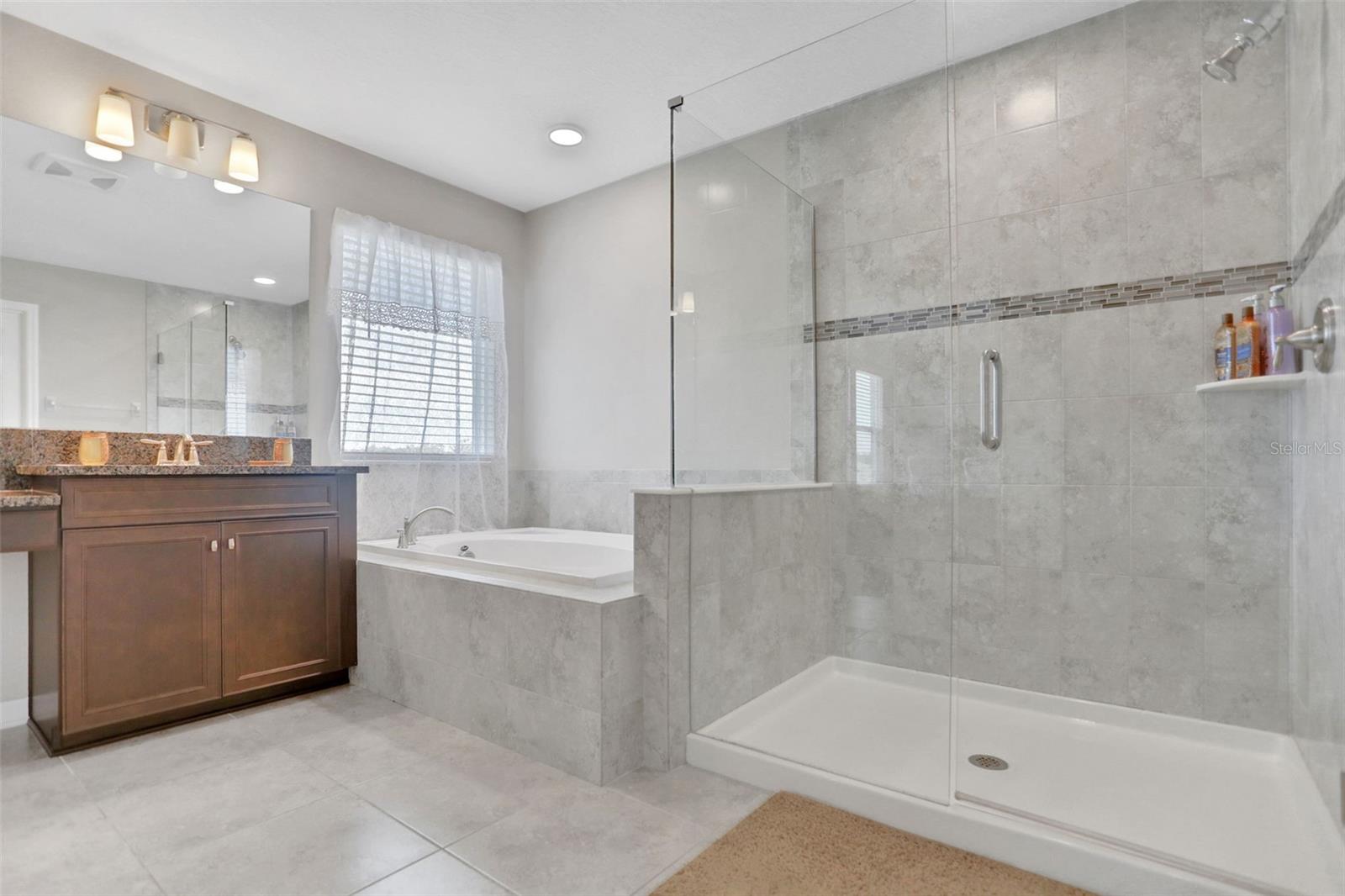 Dual vanity, soaking tub plus a separate large shower and water closet