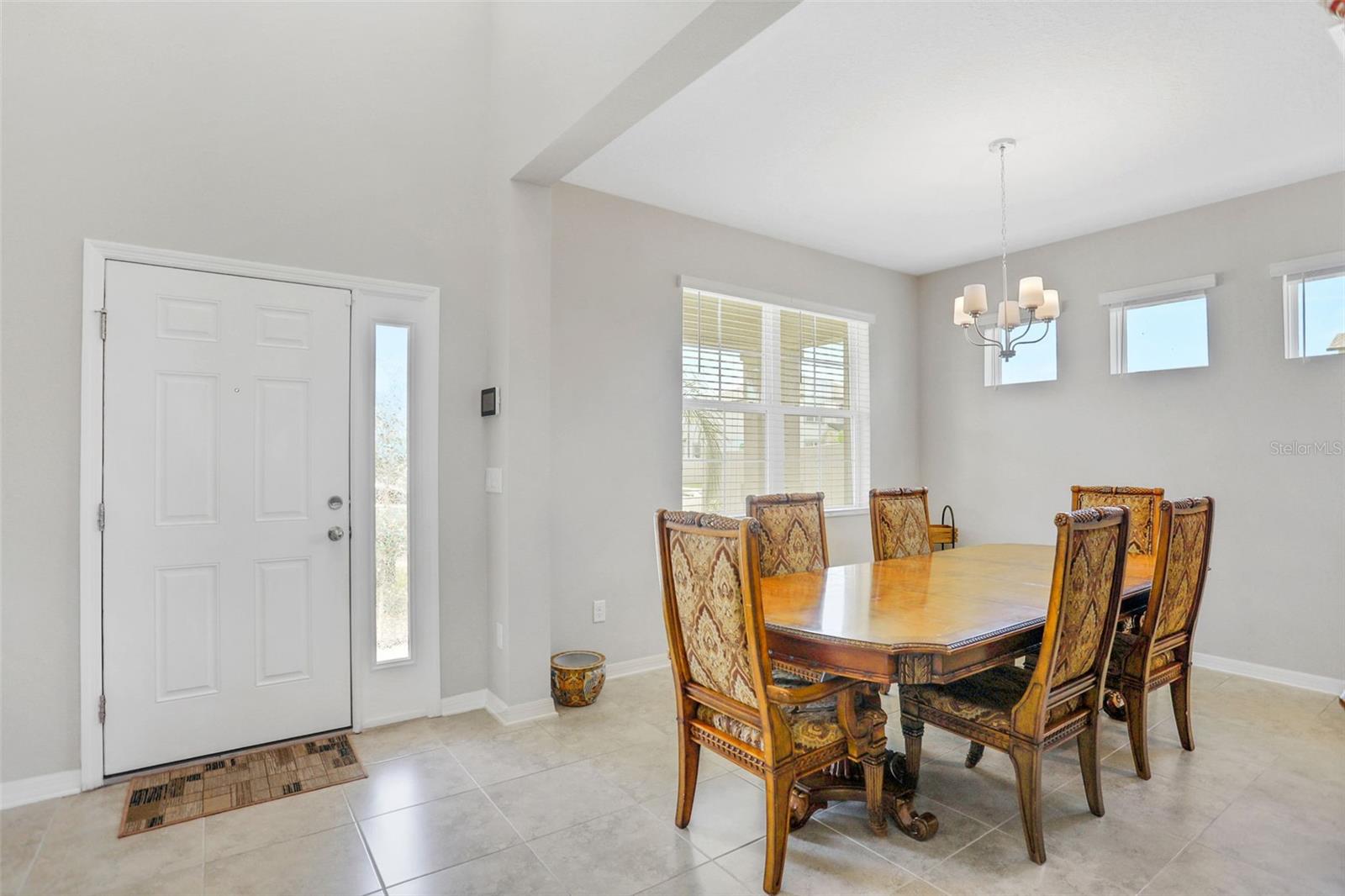Foyer and dining room.  Easily add French Doors to create the flex room/office that is on this Mira Lago floor plan