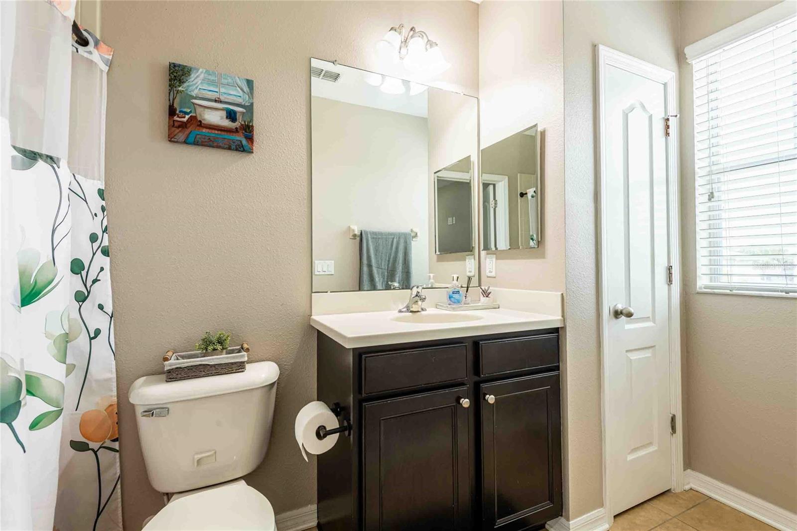 Bathroom with linen closet.