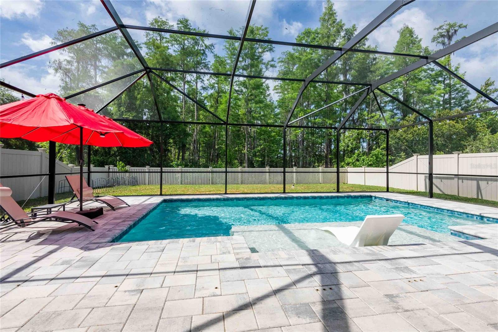 Enjoy the conservation view while relaxing at your pool!