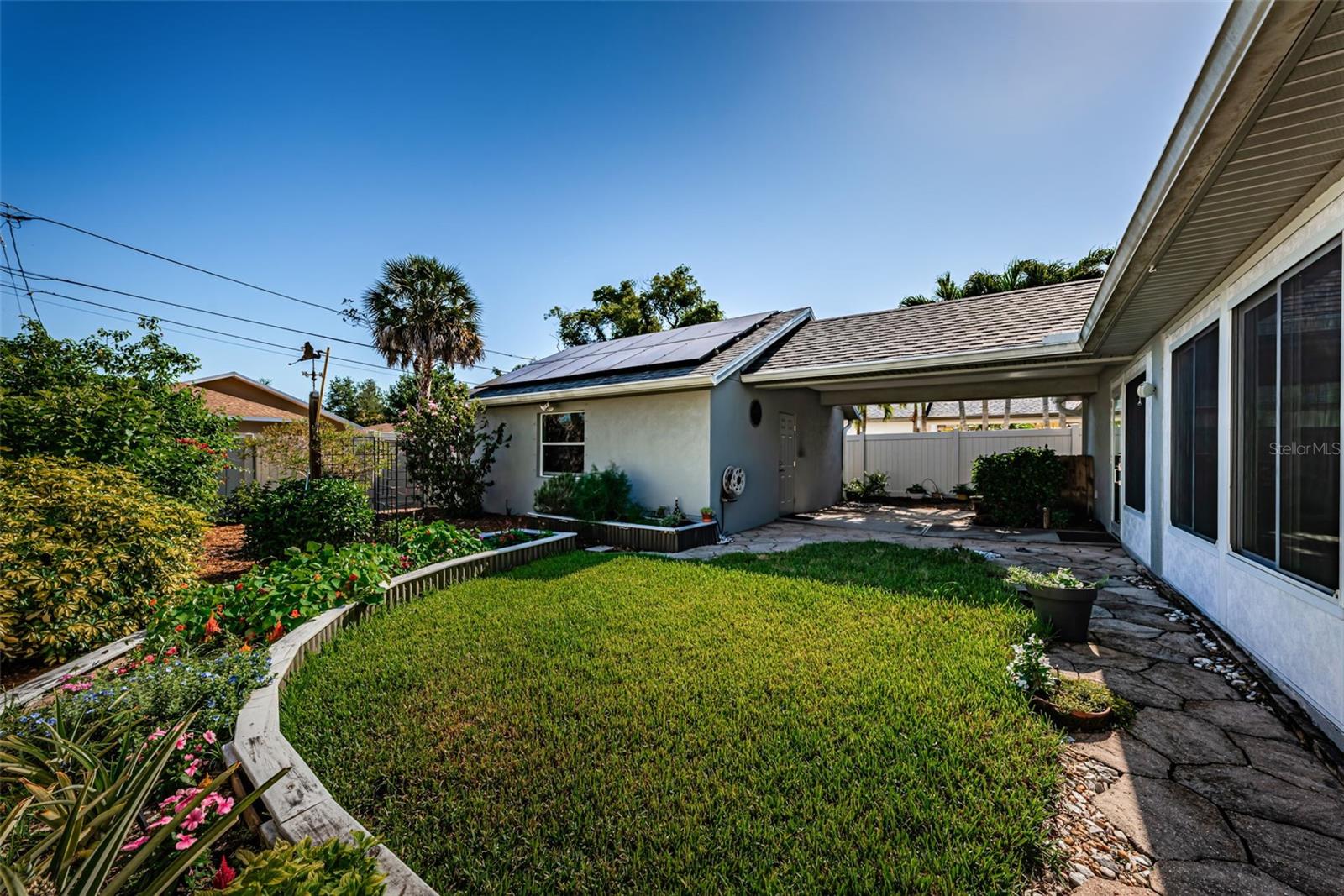 Back yard with breezeway to garage
