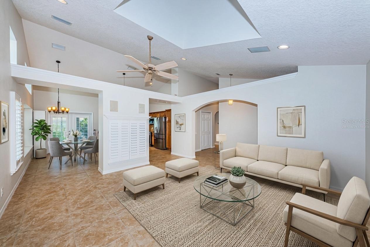 Living room with vaulted ceilings - virtually staged