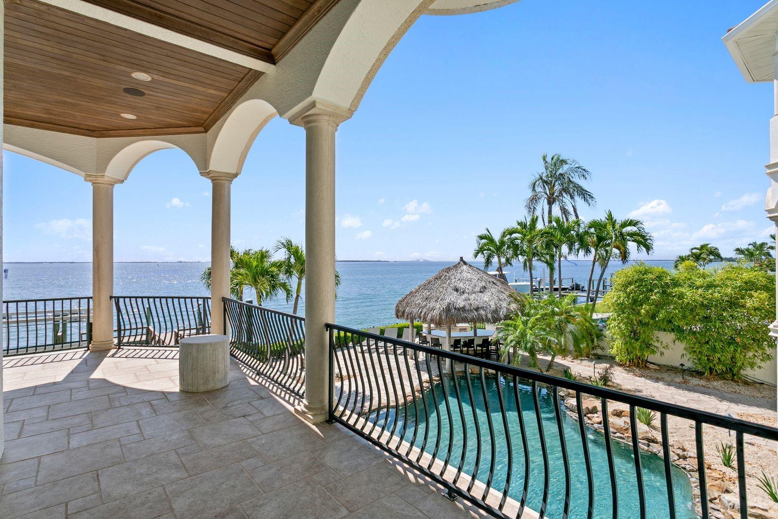 The right side of the balcony just outside the family room, enjoy breathtaking views of Tampa Bay, the pool and the outdoor entertaining space.