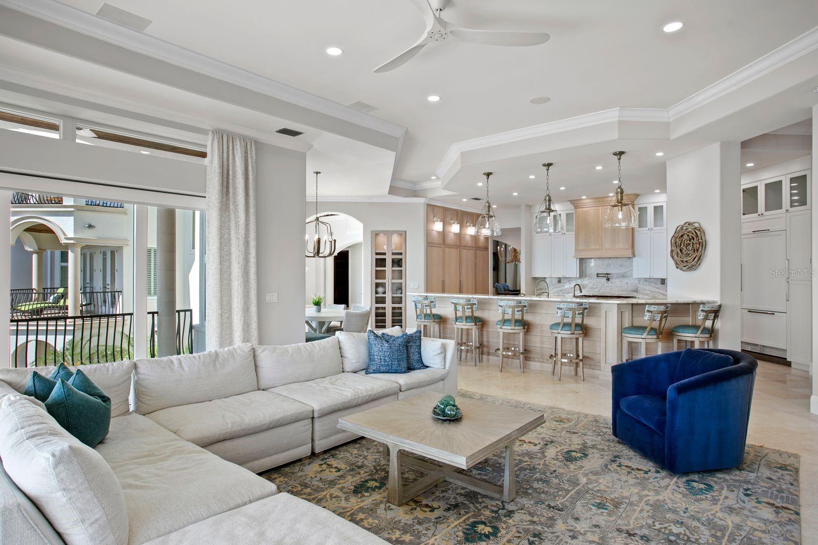 A beautifully integrated layout blends the kitchen and family room into one expansive gathering space.