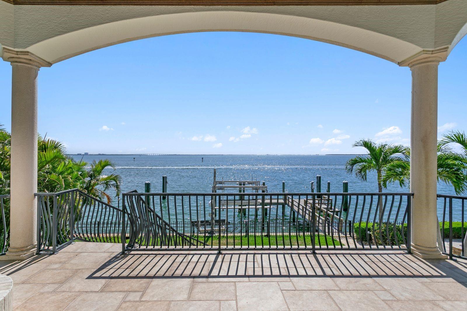 View from the balcony off of the family room, overlooking the dock and sparkling water.