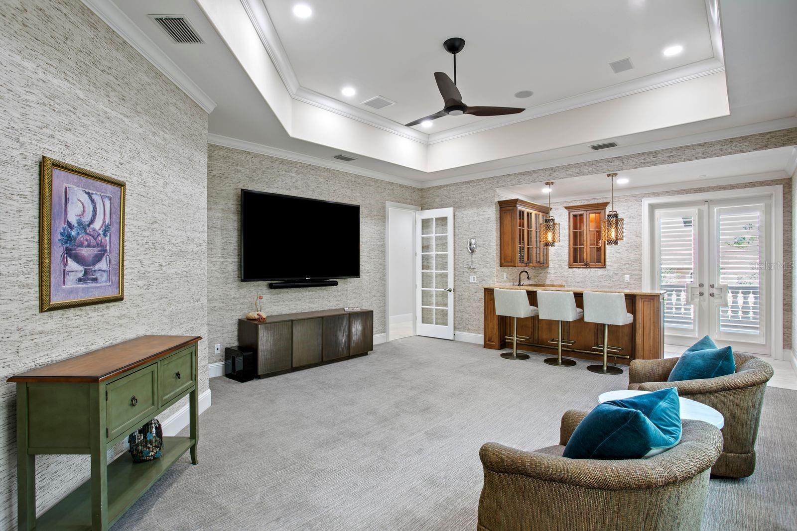Elegant social lounge featuring a refinded bar.