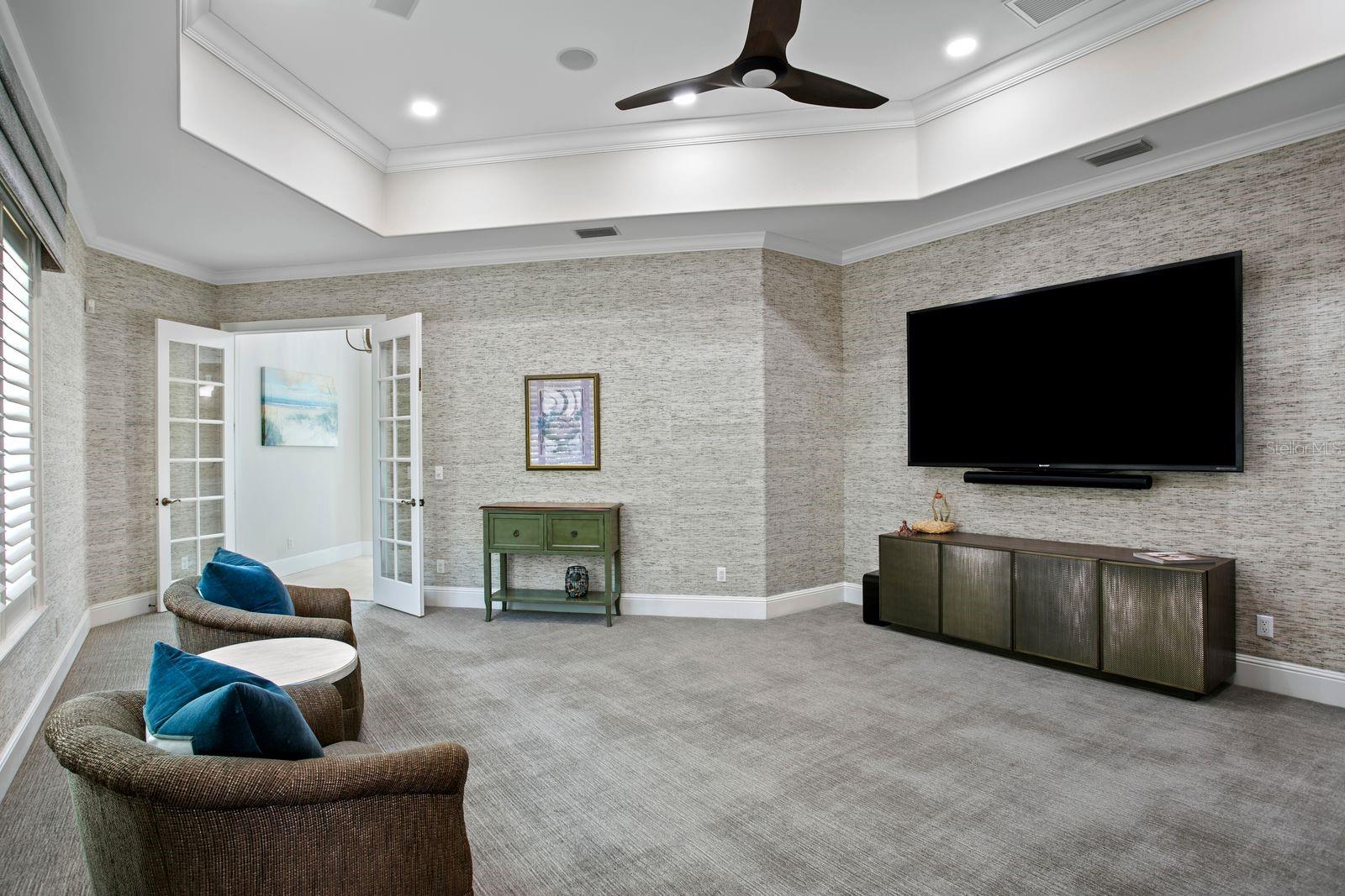 Another view of the social lounge, highlighted by plush luxury carpeting.