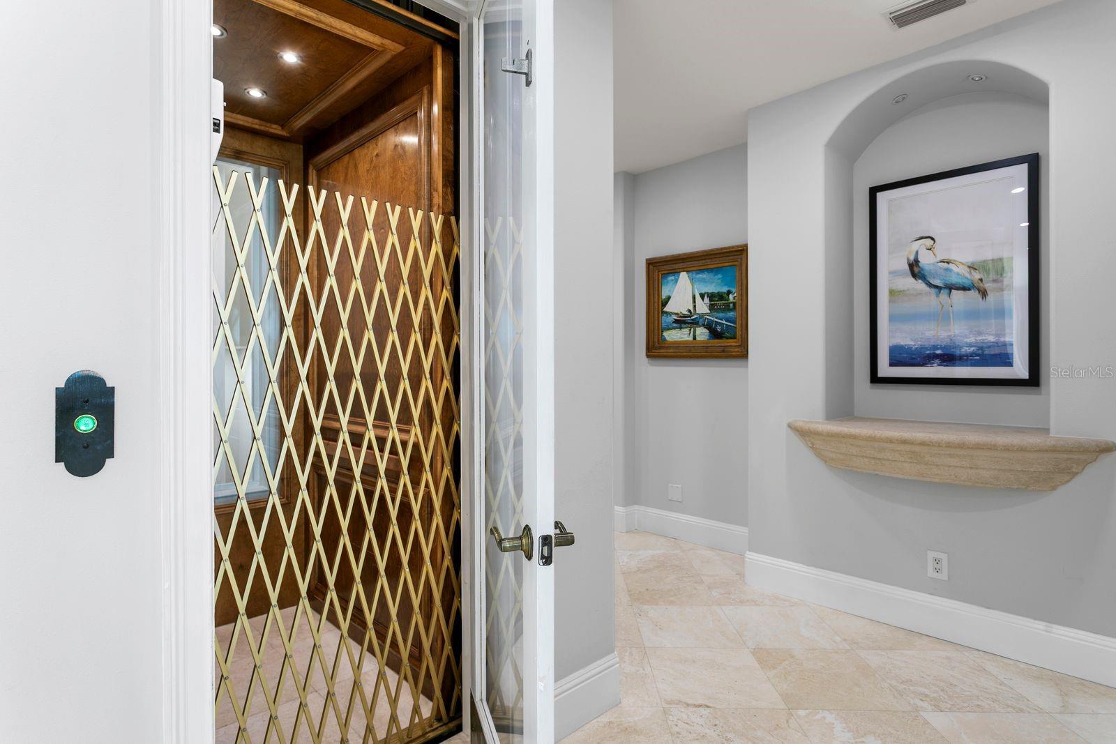 The residence is equipped with a private elevator for effortless access to all floors.