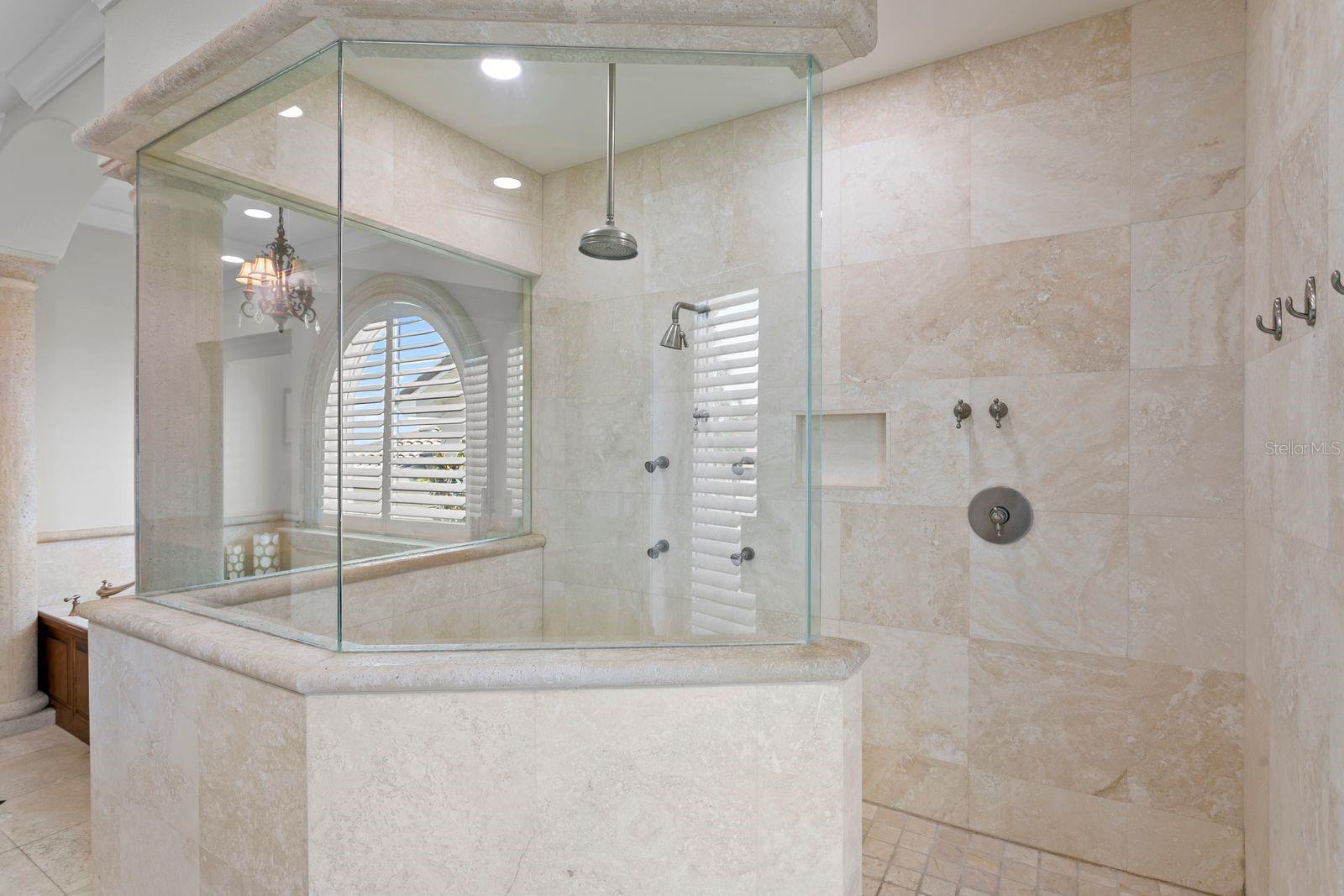 Top level primary ensuite with soaking tub and walk-in shower.