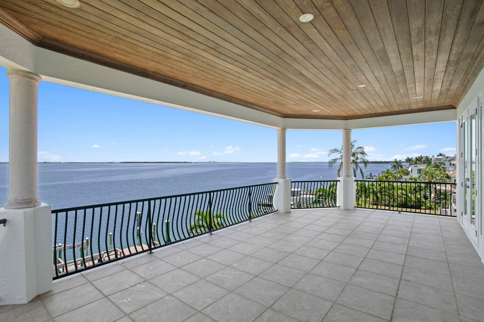 Spacious top level balcony connecting to bedrooms two and three.
