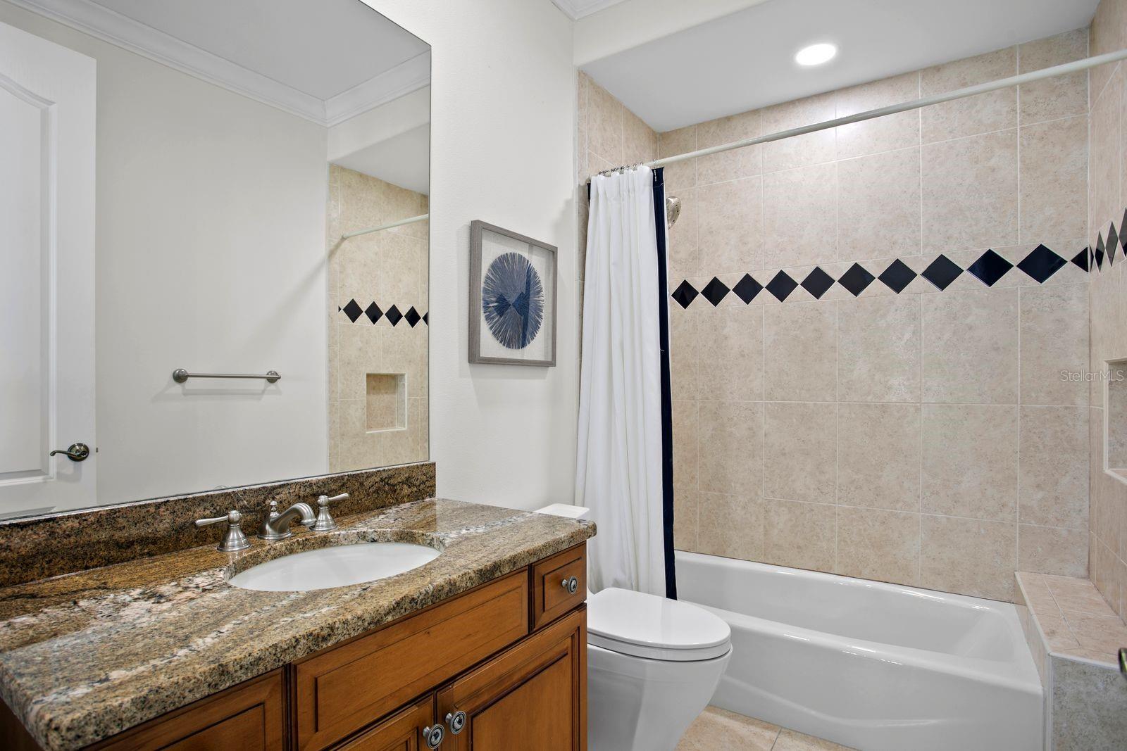 Top level bedroom three with a private ensuite.