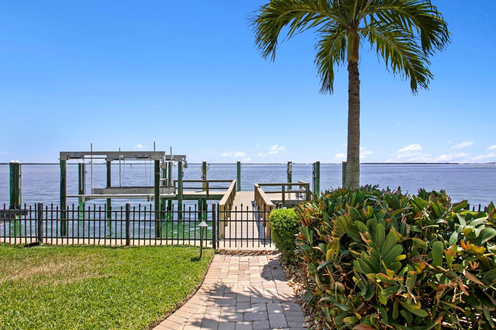 The residence includes a 10,000lb boat lift, a jet ski lift and a generous boat slip.