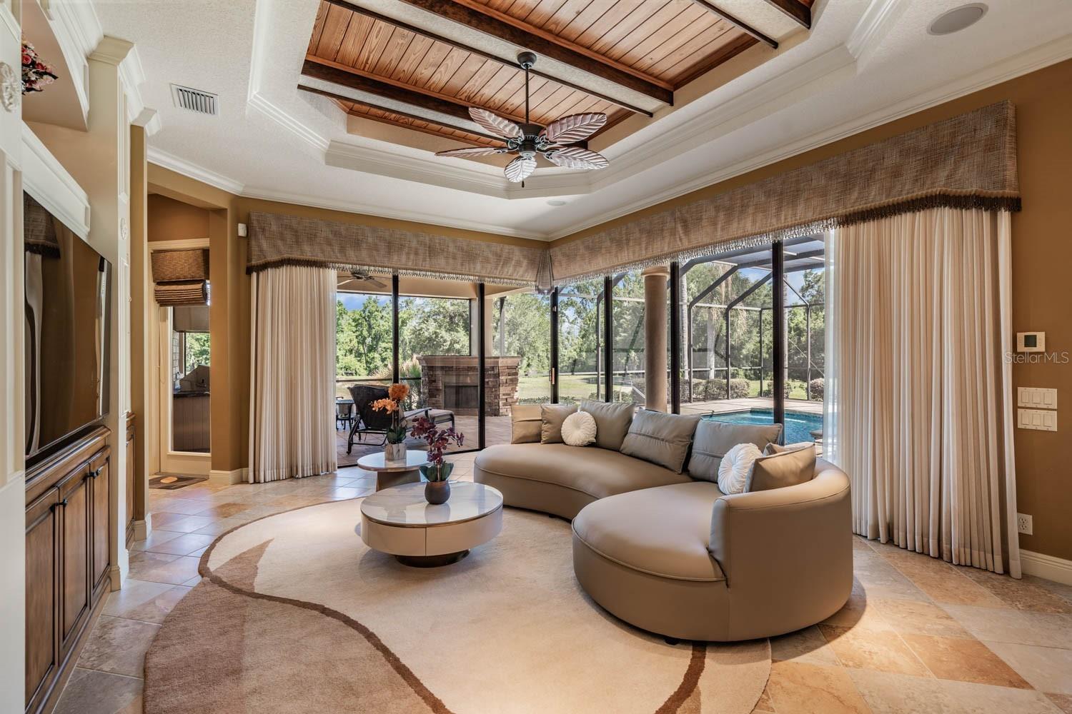Wood inlay tray ceiling, custom window treatments and area rug in this Furnished home!