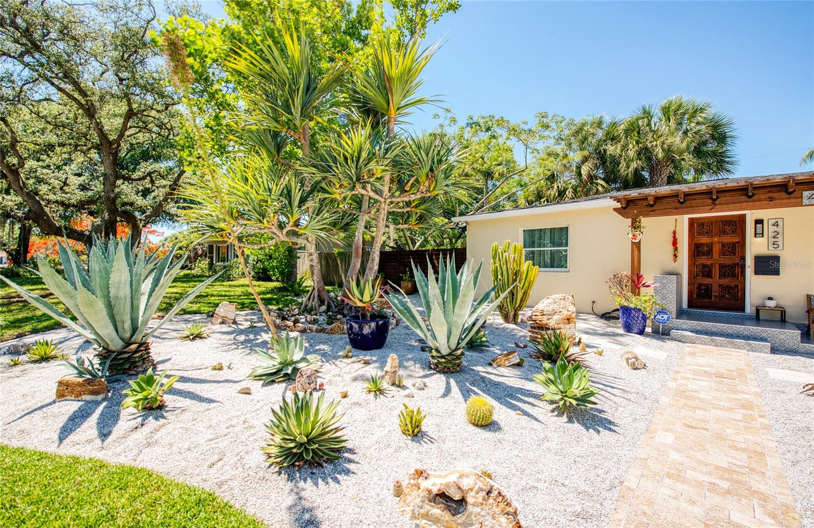 CASA BAJA: Desert Landscaping - pebble rocks, agaves, Zion boulders, barrel cactus, assorted cacti, screw pine palm