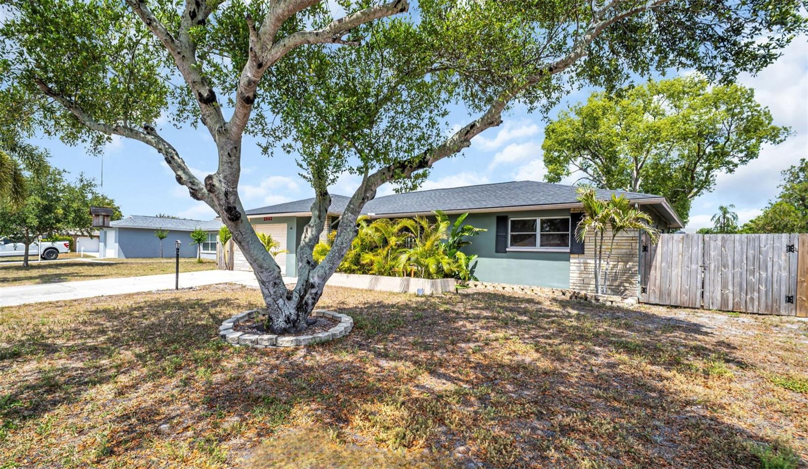 Oversized lot, widened driveway, and a fully fenced yard with double gates to store all your toys~