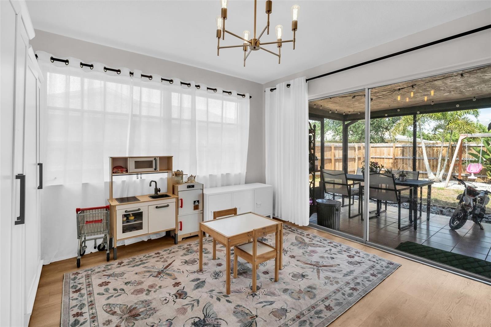 Bonus room/flex space offers glass sliders out to the covered back patio~
