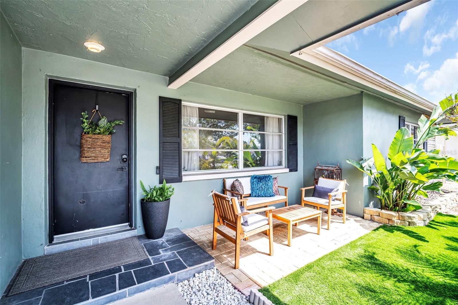 Gracious front entry with front patio seating~