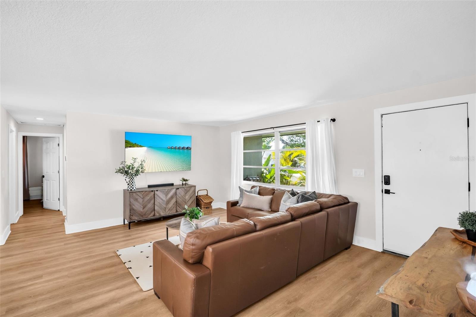 Luxury vinyl plank flooring flows seamlessly throughout~