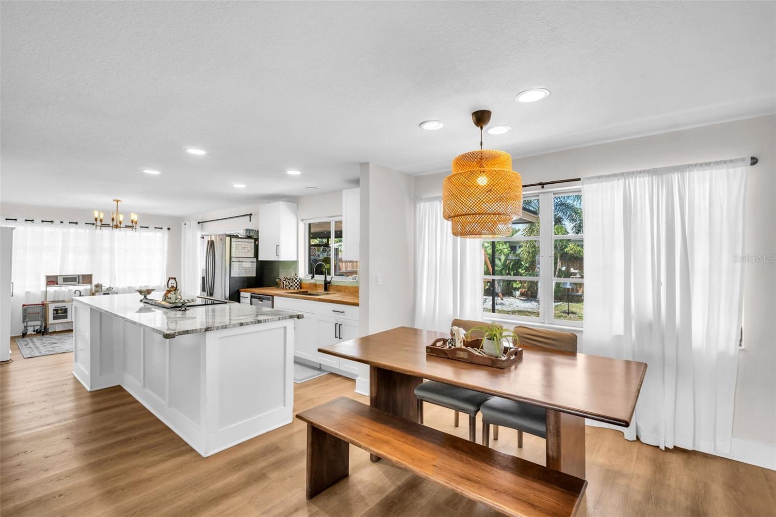 Large windows overlooking the oversized and private backyard~
